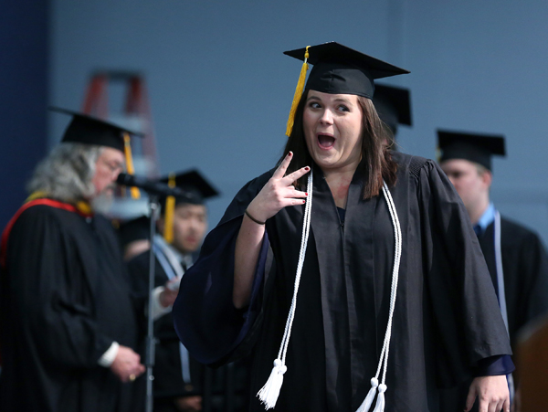 Macy Koch celebrates while receiving her diploma during the December commencement at UW-Stout.
