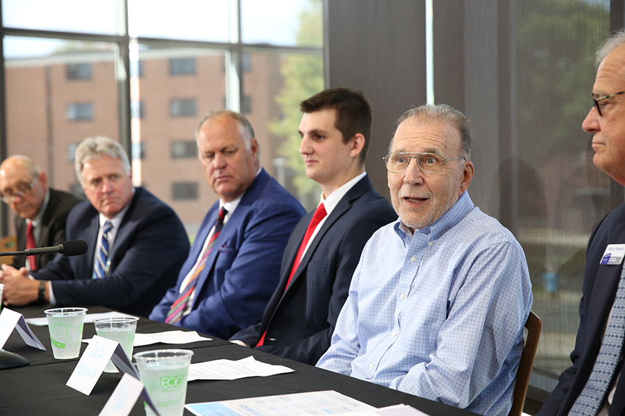 Dallas Pankowski, second from right, speaks at the Pathways Forward news conference. 