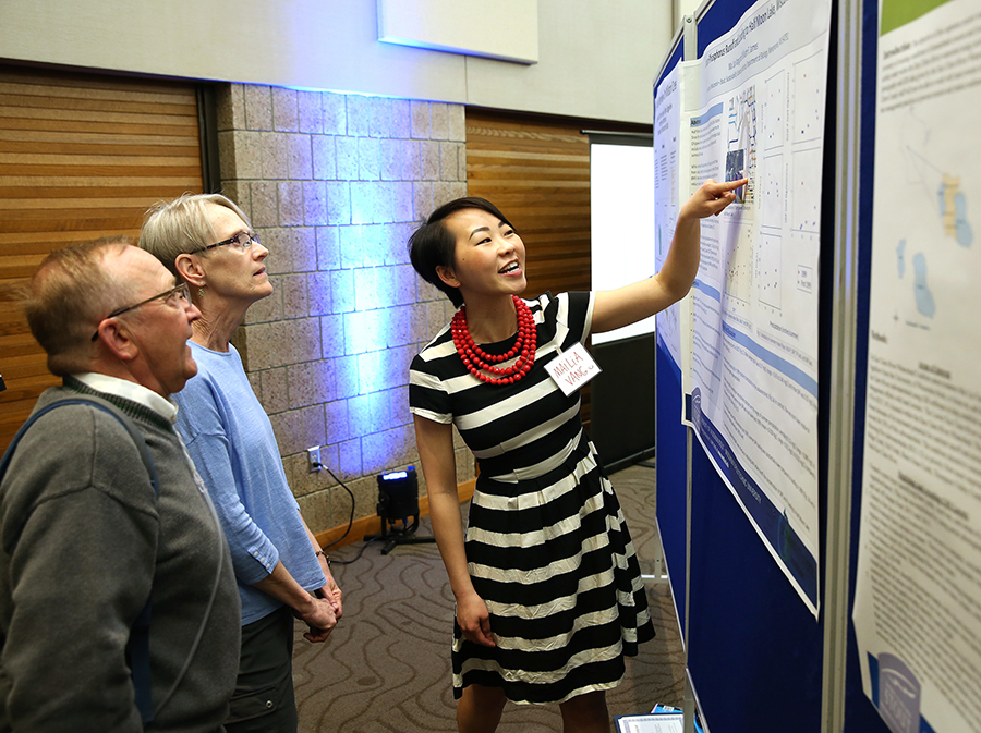 Mailia Vang talks about her research project during Research Day in 2018.