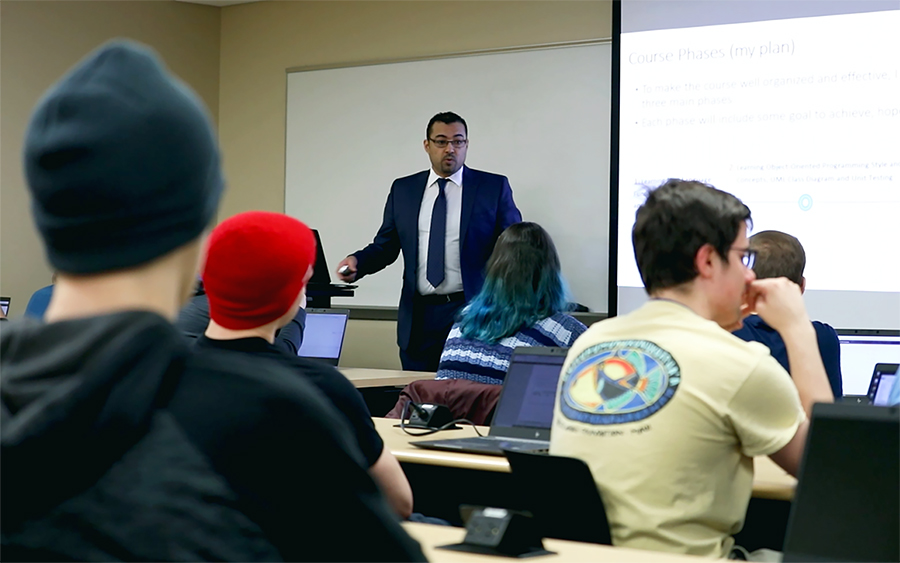 Saleh Alnaeli, who teaches computer science, lectures in a class at UW-Stout.