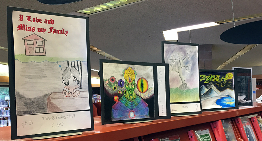 ​    ​Some of the artwork created by Dunn County Jail inmates in the exhibit “Dark Days Bring out Distorted Beauties” at the Menomonie Public Library.