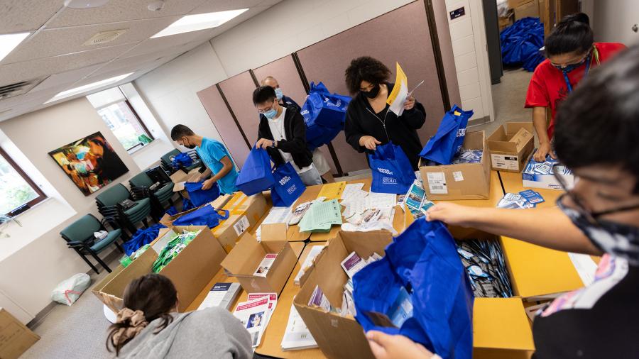 Stoutward Bound students helped prepare bags for the Knock and Talk initiative to welcome off campus students back to school.