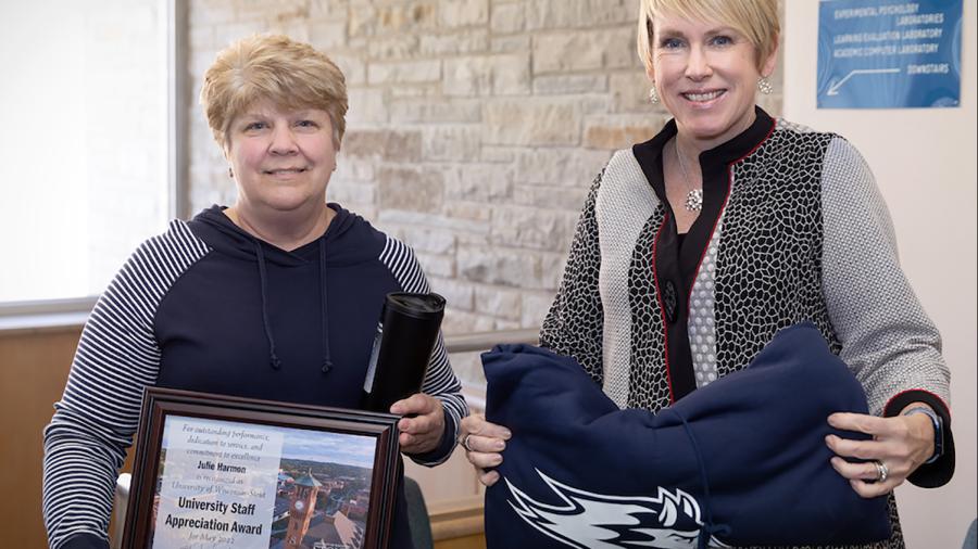 Julie Harmon, left, receives the May University Staff Appreciation Award from Chancellor Katherine Frank.