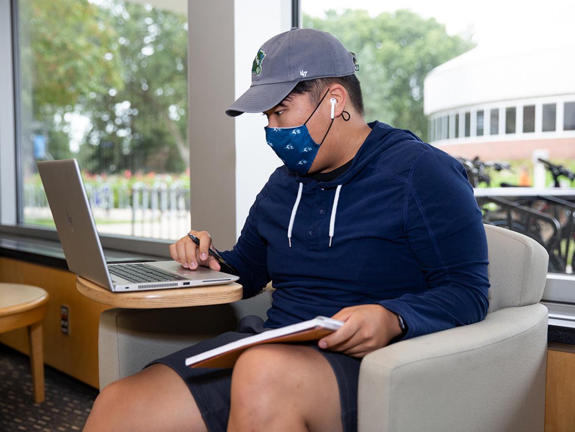 A student studying on campus.