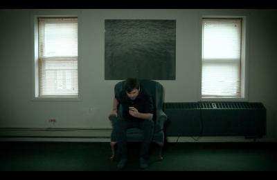 Still of the character Phone Addict from Greg Borman's short film "Susceptible."