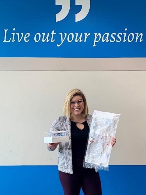UW-Stout student Sarah Webber holds packaging she has helped design and develop during a co-op at Smiths Medical in Plymouth, Minn.