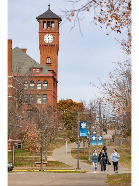 Students walking near Bowman Hall Clock Tower